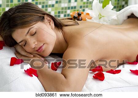 Hispanic woman laying on massage table View Large Photo Image Stock Image - Hispanic woman laying on massage table. Fotosearch
