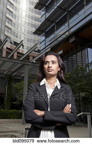 Indian businesswoman with arms crossed View Large Photo Image Stock Photo - Indian businesswoman with arms crossed. Fotosearch