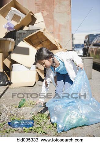 Korean girl picking up plastic bottles View Large Photo Image Stock Image - Korean girl picking up plastic bottles. Fotosearch