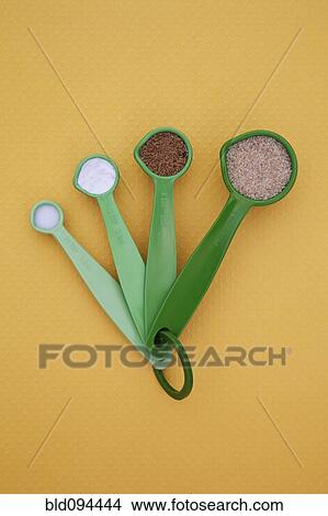 Picture - Measuring spoons full of spices. Fotosearch