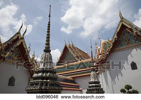 Stock Photograph - Ornate rooftops of Phra Chedi Roi. Fotosearch