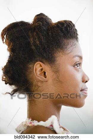 Stock Image - Profile of smiling Black woman. Fotosearch