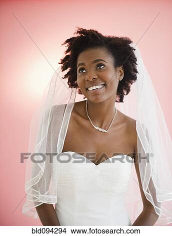 Picture - Smiling Black bride in wedding dress. Fotosearch