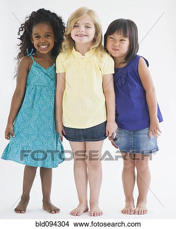 Smiling girls standing together View Large Photo Image Picture - Smiling girls standing together. Fotosearch