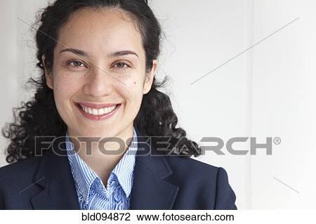 Stock Image - Smiling Hispanic businesswoman. Fotosearch