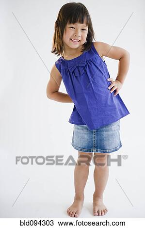 Smiling Korean girl with hands on hips View Large Photo Image Stock Image - Smiling Korean girl with hands on hips. Fotosearch