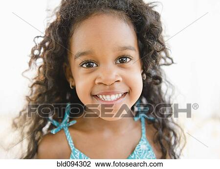 Smiling mixed race girl View Large Photo Image Stock Image - Smiling mixed race girl. Fotosearch
