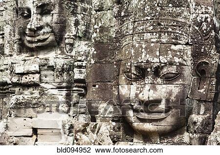Stock Image - Stone faces in Avalokiteshvara, Bayon Temple. Fotosearch