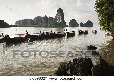 Stock Photo - Thai boats moored in ocean. Fotosearch
