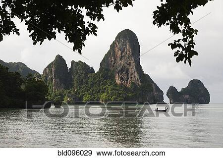 Stock Photo - Thai long tail boat on ocean. Fotosearch