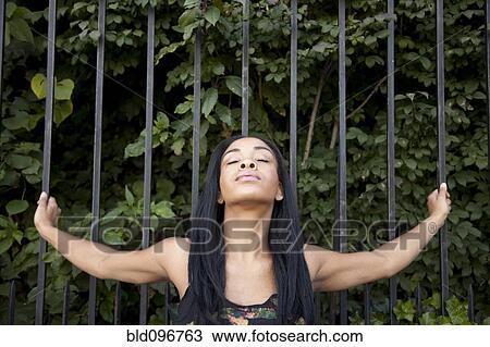 African American woman standing with arms outstretched View Large Photo Image Stock Image - African American woman standing with arms outstretched. Fotosearch