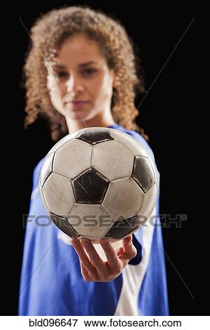 Caucasian soccer player holding ball View Large Photo Image Stock Photo - Caucasian soccer player holding ball. Fotosearch