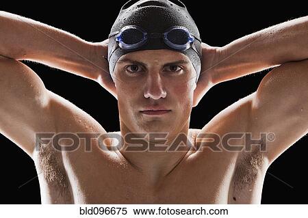 Stock Photography - Caucasian teenage boy in swim cap and goggles. Fotosearch