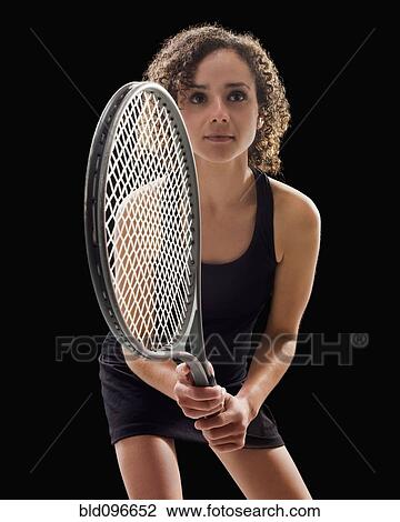 Stock Image - Caucasian tennis player holding tennis racket. Fotosearch