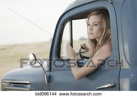Caucasian woman driving old-fashioned truck View Large Photo Image Picture - Caucasian woman driving old-fashioned truck. Fotosearch