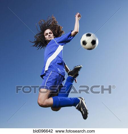 Caucasian woman kicking soccer ball View Large Photo Image Stock Image - Caucasian woman kicking soccer ball. Fotosearch