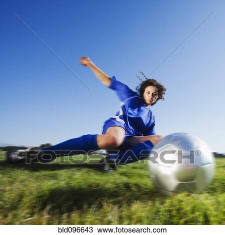 Caucasian woman kicking soccer ball View Large Photo Image Stock Image - Caucasian woman kicking soccer ball. Fotosearch