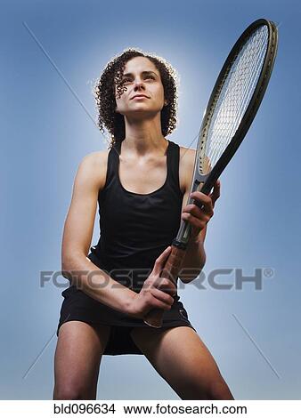 Caucasian woman playing tennis View Large Photo Image Picture - Caucasian woman playing tennis. Fotosearch