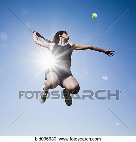 Caucasian woman playing tennis View Large Photo Image Stock Image - Caucasian woman playing tennis. Fotosearch