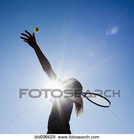 Stock Photo - Caucasian woman playing tennis. Fotosearch