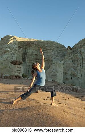 Caucasian woman practicing yoga in desert View Large Photo Image Stock Image - Caucasian woman practicing yoga in desert. Fotosearch