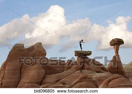 Caucasian woman practicing yoga on top of rock formation View Large Photo Image Stock Photography - Caucasian woman practicing yoga on top of rock formation. Fotosearch