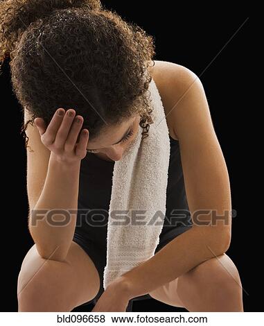 Stock Photo - Caucasian woman tired after exercise. Fotosearch