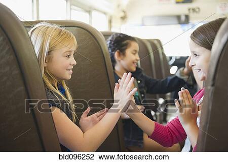 Children playing while riding school bus View Large Photo Image Stock Image - Children playing while riding school bus. Fotosearch
