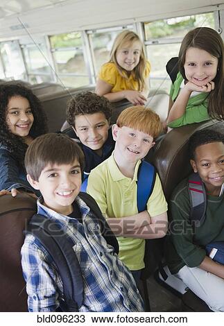 Children riding school bus View Large Photo Image Stock Image - Children riding school bus. Fotosearch