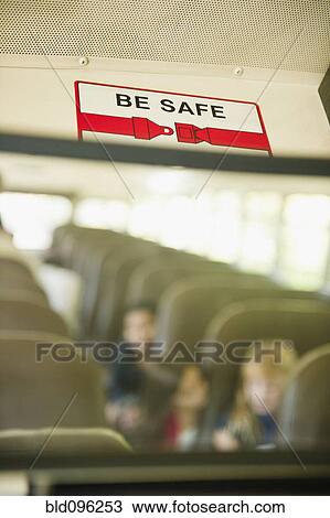 Stock Image - Children riding school bus. Fotosearch