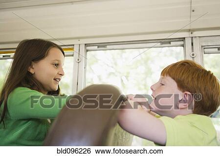 Children riding school bus View Large Photo Image Stock Photograph - Children riding school bus. Fotosearch