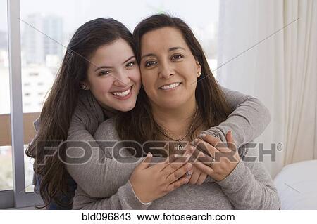 Chilean daughter hugging mother View Large Photo Image Stock Image - Chilean daughter hugging mother. Fotosearch