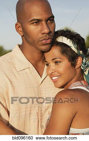 Couple hugging outdoors View Large Photo Image Stock Image - Couple hugging outdoors. Fotosearch