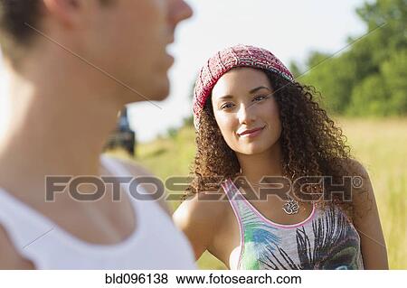 Couple standing together outdoors View Large Photo Image Stock Photo - Couple standing together outdoors. Fotosearch