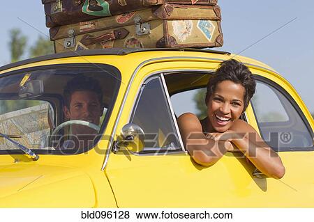 Stock Photo - Excited couple on road trip. Fotosearch