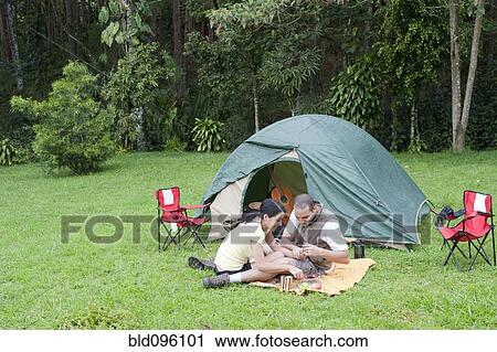 Hispanic couple camping together View Large Photo Image Stock Image - Hispanic couple camping together. Fotosearch
