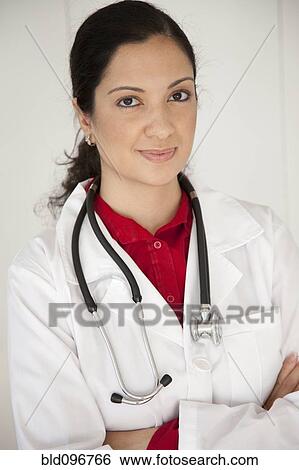 Mixed race doctor in lab coat with arms crossed View Large Photo Image Stock Photograph - Mixed race doctor in lab coat with arms crossed. Fotosearch