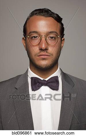 Serious Caucasian man in suit and bow tie View Large Photo Image Stock Image - Serious Caucasian man in suit and bow tie. Fotosearch