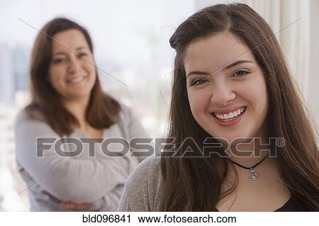 Stock Image - Smiling Chilean mother and daughter. Fotosearch