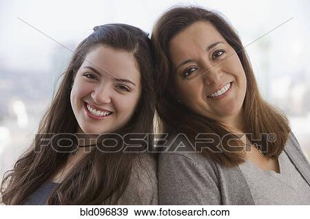 Stock Photo - Smiling Chilean mother and teenage daughter. Fotosearch