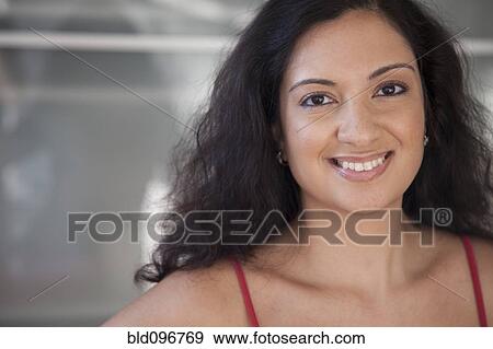 Stock Photo - Smiling mixed race woman. Fotosearch