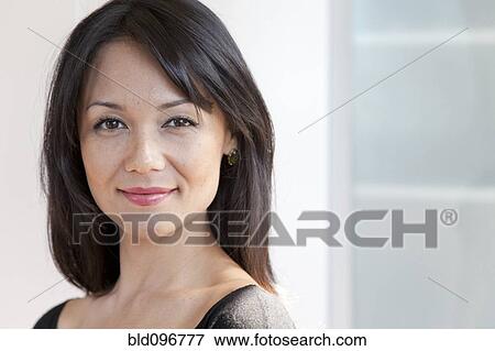 Stock Photo - Smiling mixed race woman. Fotosearch