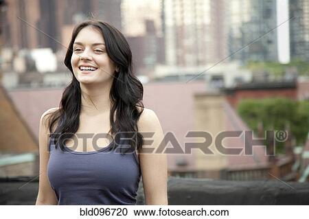 Smiling woman standing outdoors View Large Photo Image Stock Image - Smiling woman standing outdoors. Fotosearch