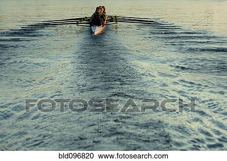 Team rowing boat in bay View Large Photo Image Stock Image - Team rowing boat in bay. Fotosearch