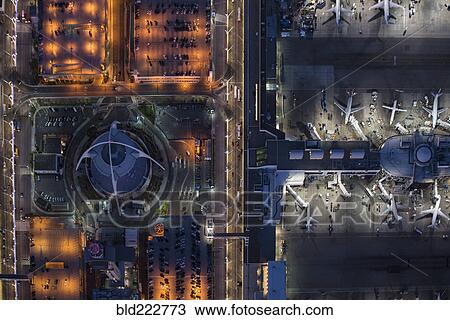 Stock Image - Aerial view of airplanes parked in airport gate. Fotosearch