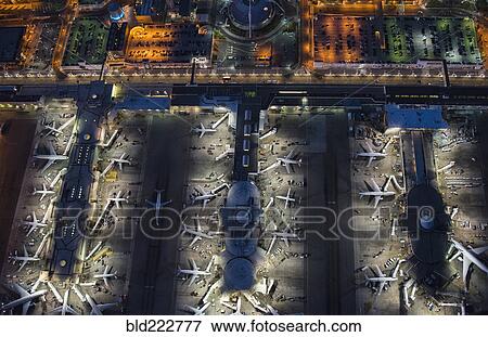 Stock Photo - Aerial view of airplanes parked in airport gates. Fotosearch