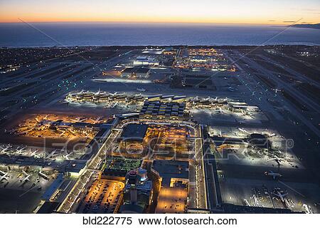 Stock Photography - Aerial view of airplanes parked in airport gates. Fotosearch