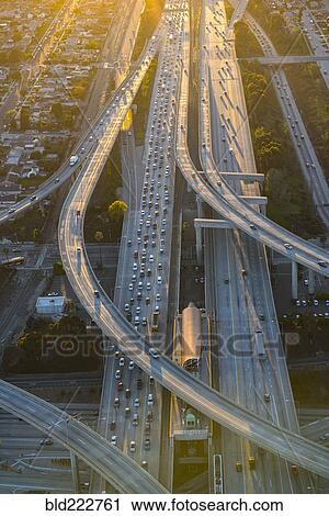 Stock Image - Aerial view of highway interchange in cityscape. Fotosearch