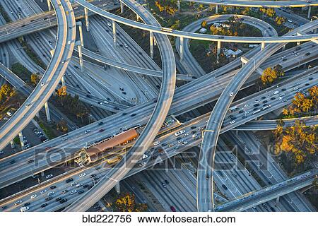 Stock Photograph - Aerial view of highway interchange in cityscape. Fotosearch