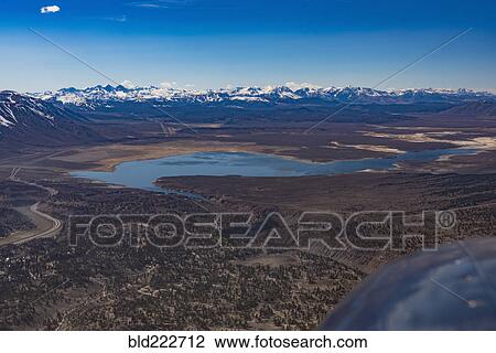 Stock Image - "Aerial view of lake and mountains, Bishop, California, United States, ". Fotosearch